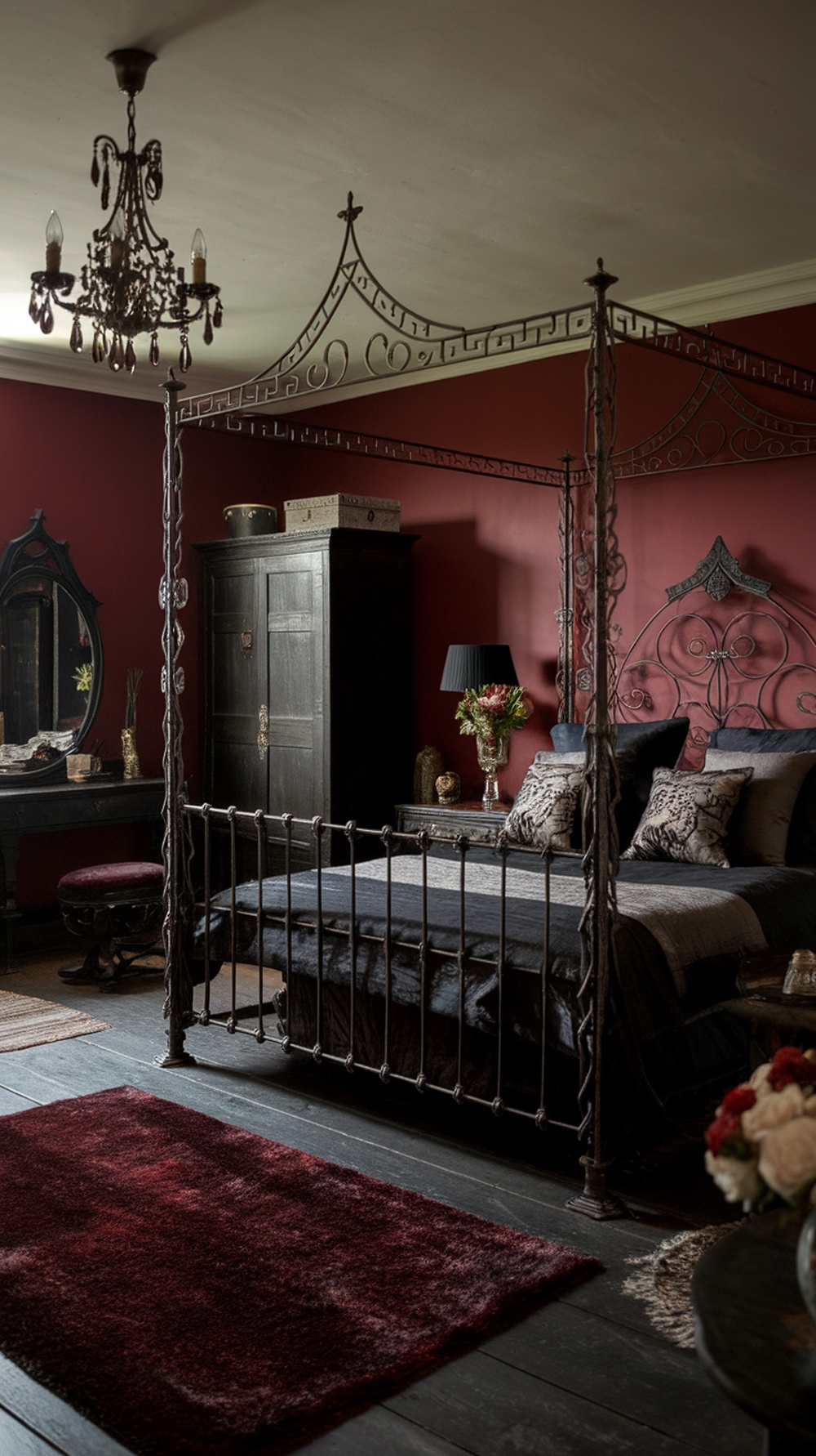 A gothic bedroom featuring an intricate iron bed frame, rich red walls, and dark decor.