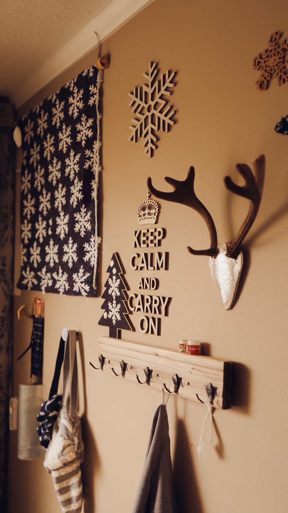 A cozy wall display featuring winter-themed decorations, including snowflakes and a motivational sign.